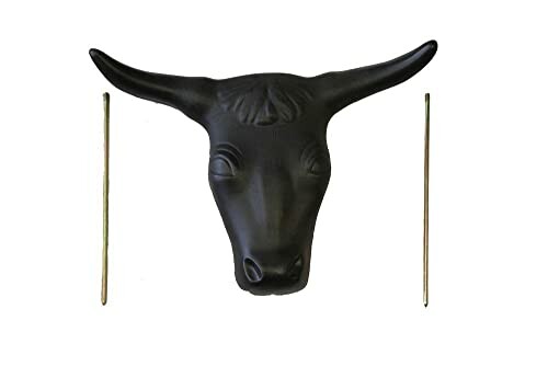 Black bull head with two sticks on white background