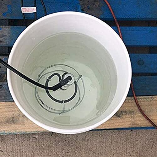 Submerged water heater in a bucket of water.