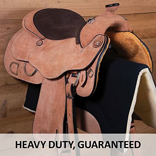 Heavy duty brown leather horse saddle on stand.