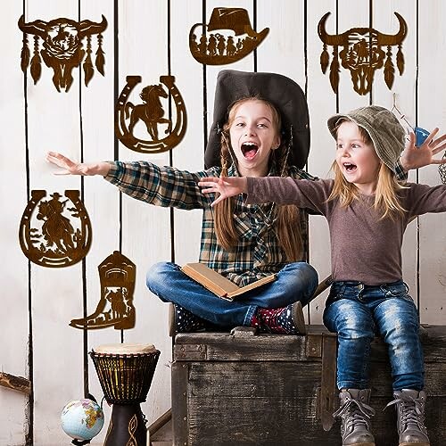 Two children excited in a Western-themed room with cowboy decorations.